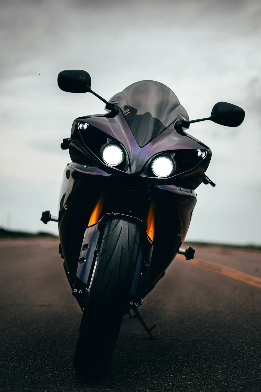 Black and gray sportbike on the road